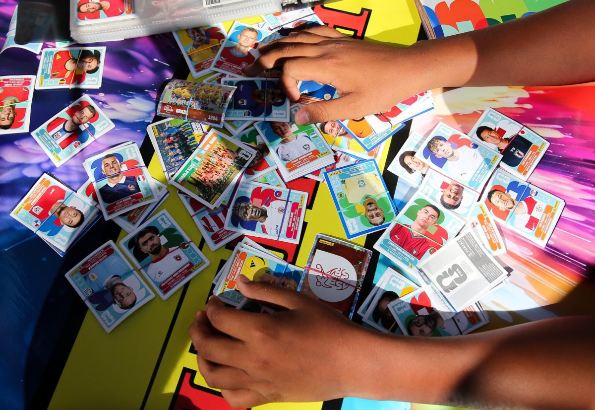 A young collector pours over stickers in hopes of making a trade on June 19 in Washington D.C.