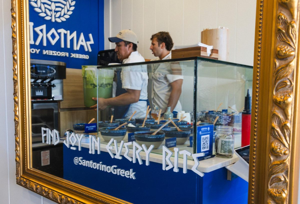 Santorino employees prepare matcha frozen yogurt for customers at their grand opening on Aug. 23
