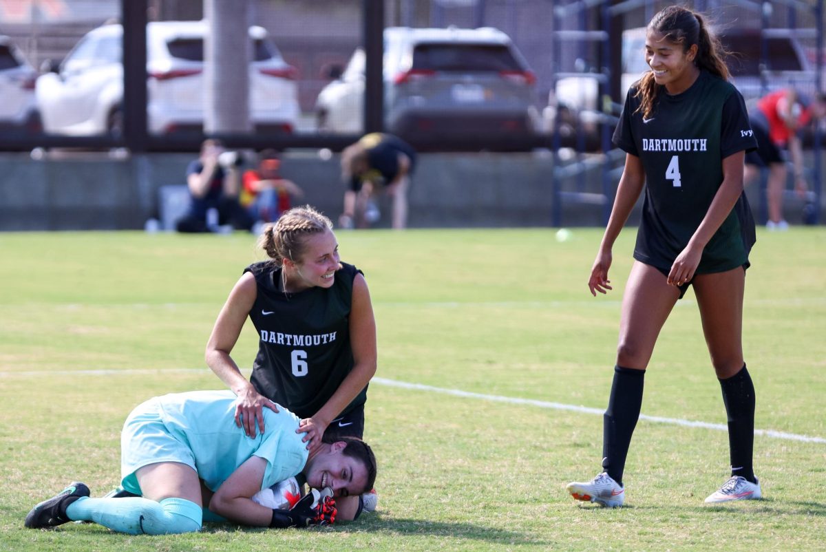 Ola Goebel (30) celebrates the game ending save with teammates following a win against Arizona at Mulcahy Stadium on Sept. 6.