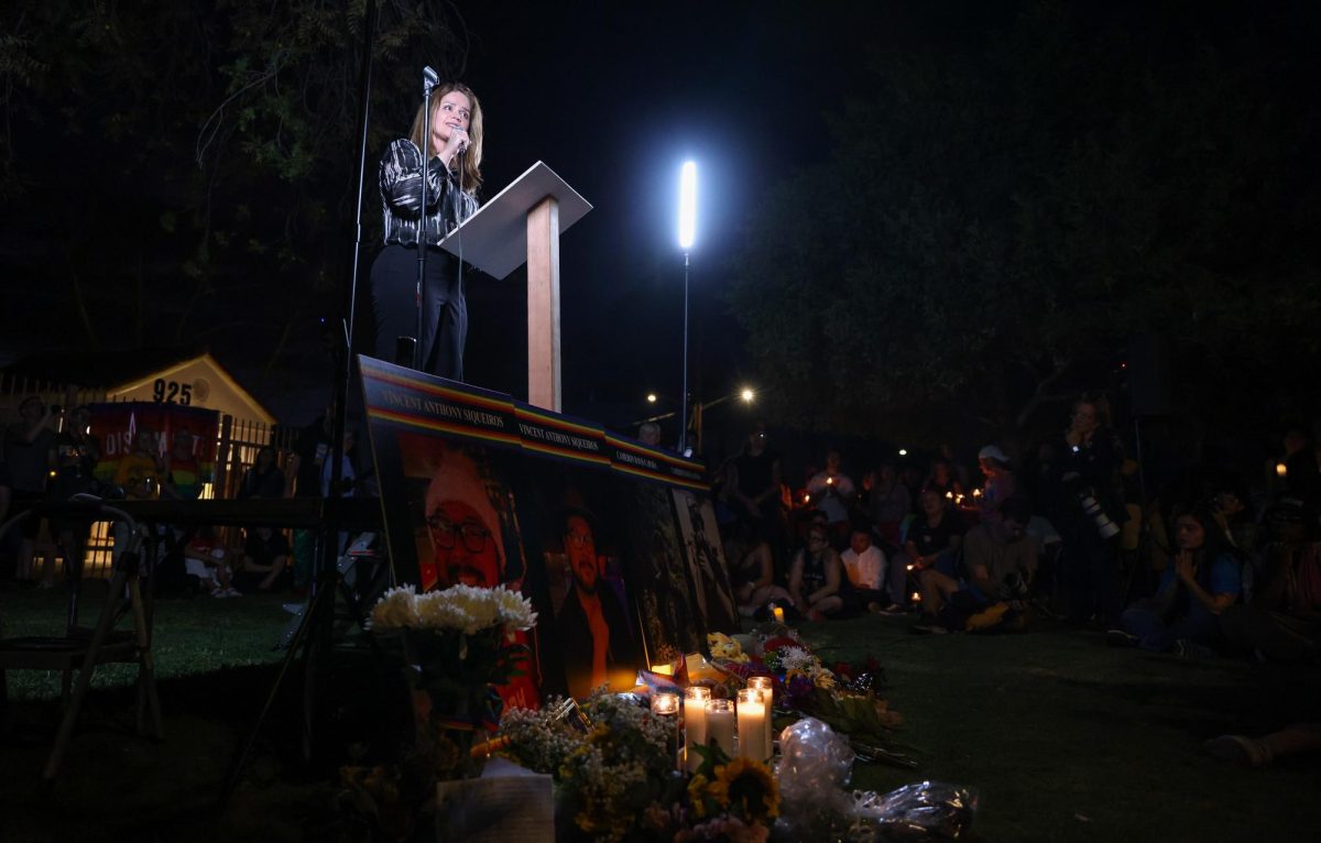 Tucson Mayor Regina Romero speaks to community members at the candlelight vigil for Vincent Anthony Siqueiros and Cameron Davis Capara at Catalina Park on Sept. 2.
