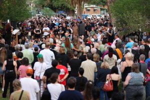 The crowd gathers to listen to speakers at the candlelight vigil for Cameron Davis Capara and Vincent Anthony Siqueiros on Sept. 2 in Catalina Park.