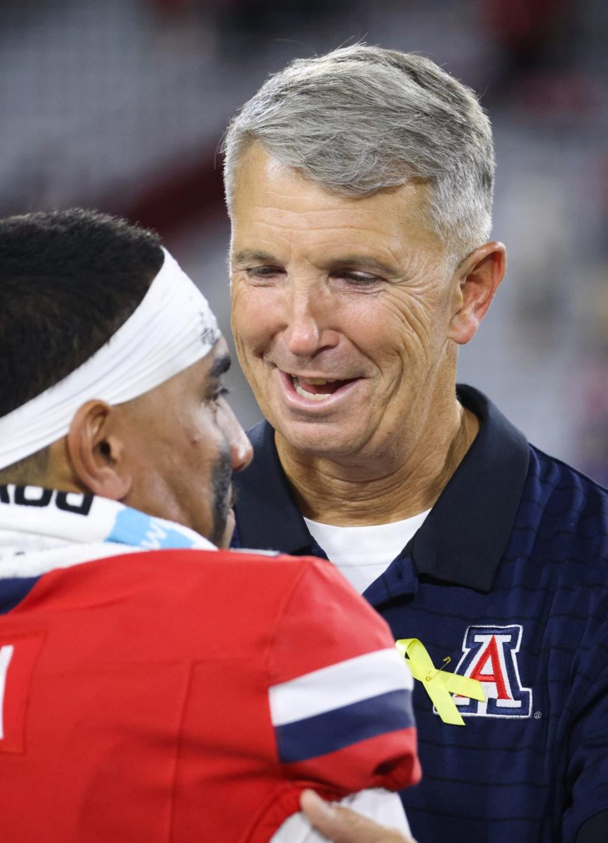 Brent Brennan congratulates Noah Fifita after their post game interview on Sept. 19 at Casino Del Sol Stadium.