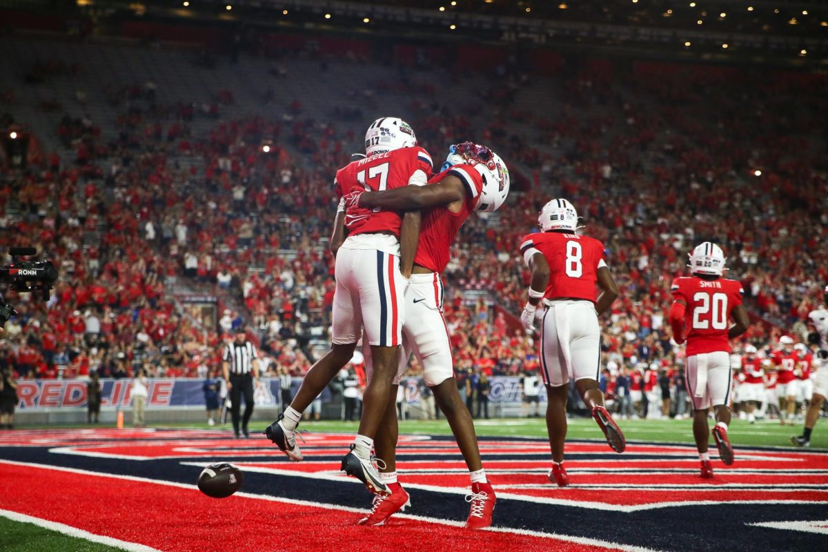 Isaiah Mizell celebrates after his first career touchdown against NIU on Sept. 19 at Casino Del Sol Stadium.