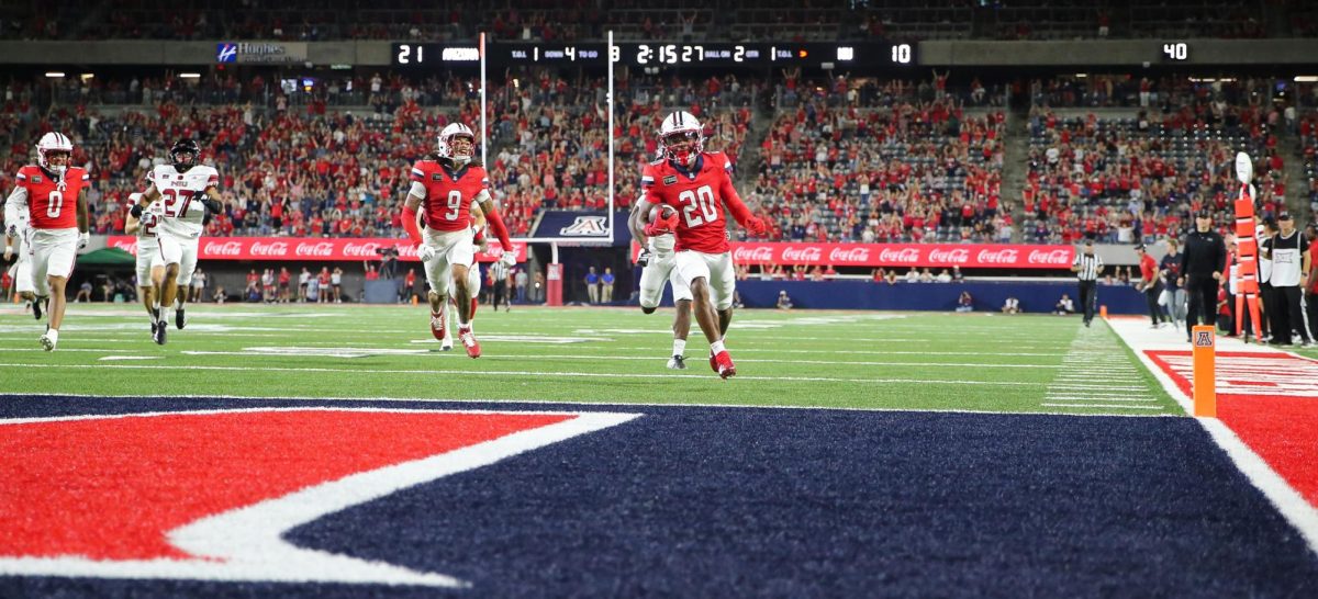 Caleb Smith runs into the endzone for a 69 yard punt return touchdown against NIU on Sept. 19 at Casino Del Sol Stadium.