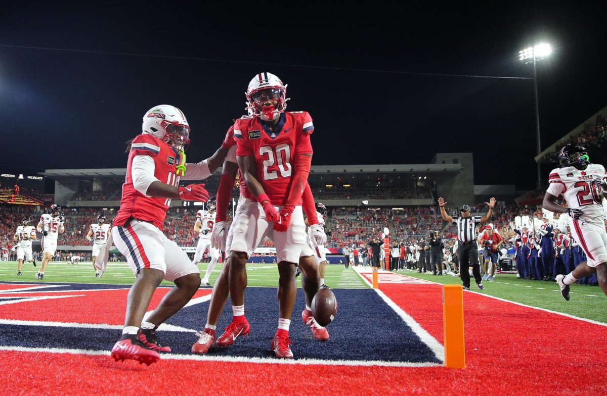 Caleb Smith celebrates his 69 yard punt return touchdown against NIU on Sept. 19 at Casino Del Sol Stadium.