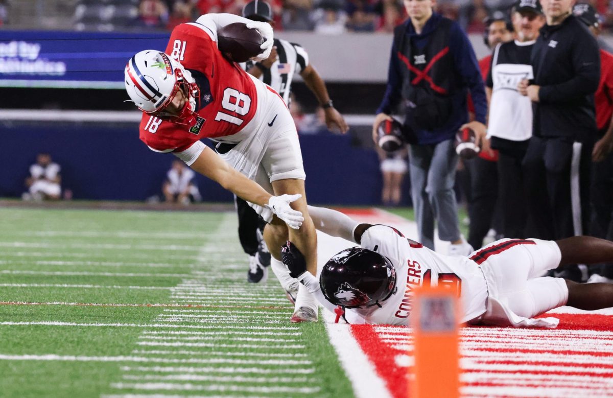 Brandon Phelps toes the line before being pulled out of bounds against NIU on Sept. 19 at Casino Del Sol Stadium.