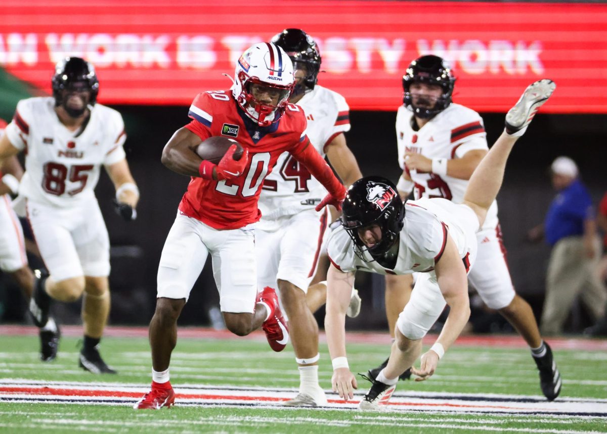 Caleb Smith breaks away for a 69 yard punt return touchdown against NIU on Sept. 19 at Casino Del Sol Stadium.