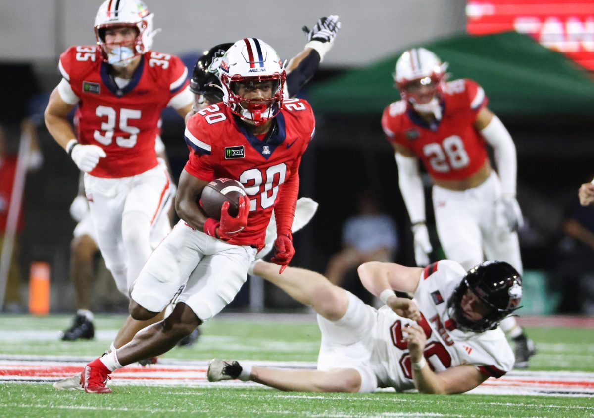 Caleb Smith breaks away for a 69 yard punt return touchdown against NIU on Sept. 19 at Casino Del Sol Stadium.