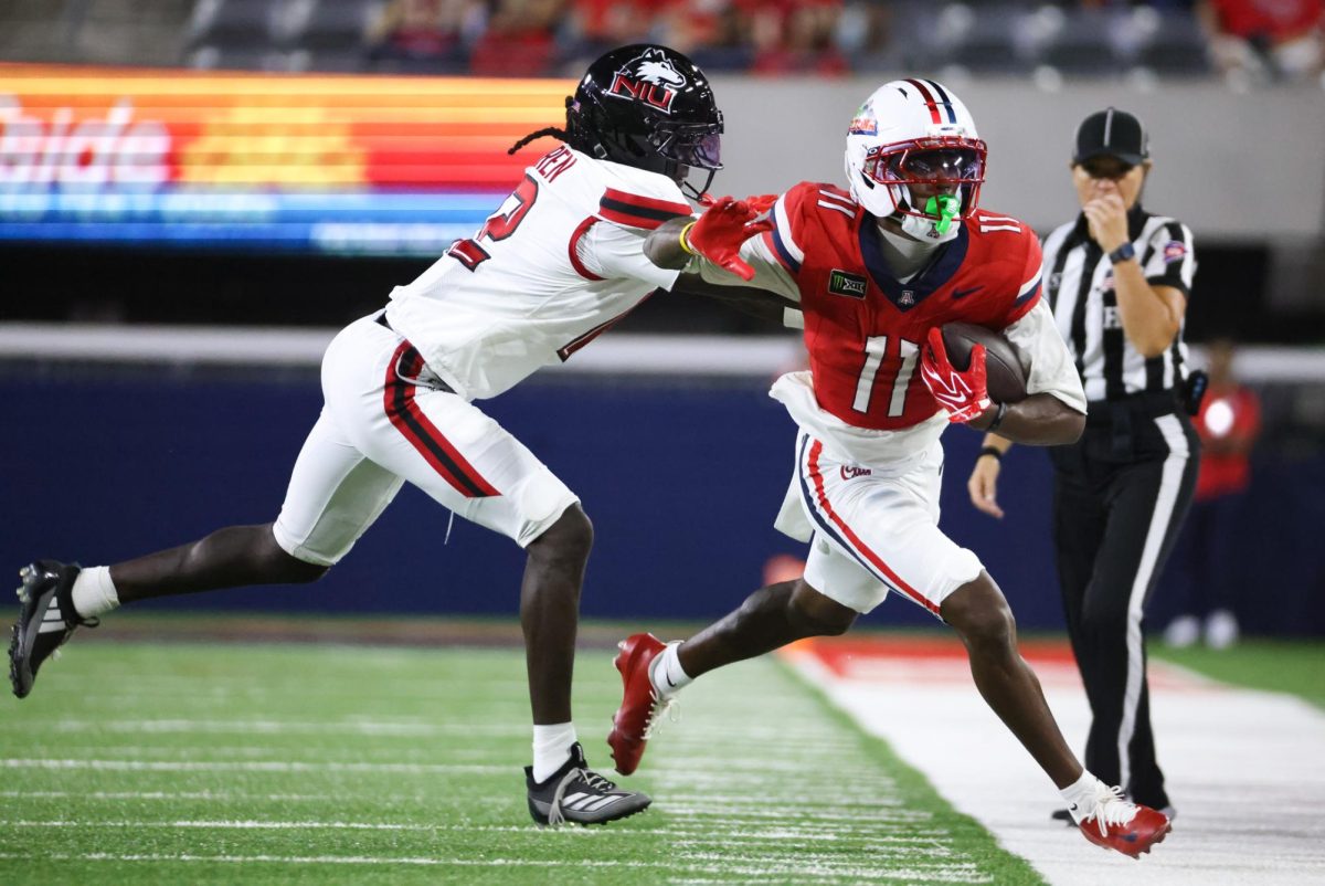Chris Hunter III gets pushed out of bounds by a NIU defender on Sept. 19 at Casino Del Sol Stadium.