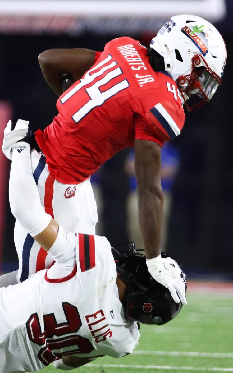 Antwan Roberts Jr. stiff arms a defender against NIU on Sept. 19 at Casino Del Stadium.