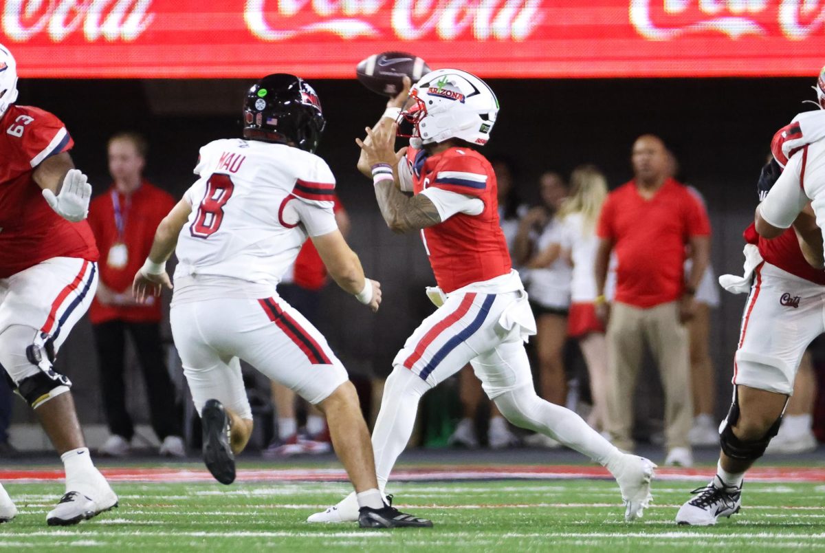 Noah Fifita throws a pass to break the all time passing yards record at Arizona against NIU on Sept. 19 at Casino Del Sol Stadium.