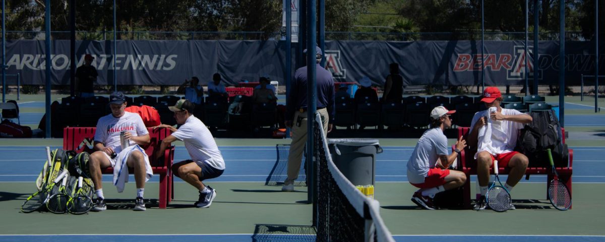 UA's Cole Stelse and UNM's David Schwarc take a break during their final match of the Kinlen and Vivian Gee Wildcat Invite.