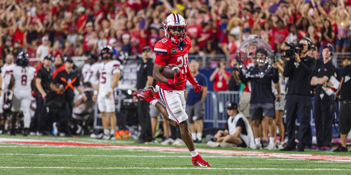 Dajon Hinton runs in for a punt return touchdown against NIU at Casino Del Sol Stadium on Sept. 19.