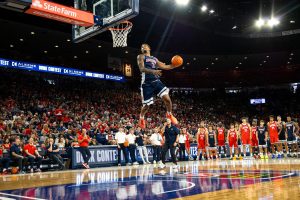 Cameron Holmes puts down his competition winning dunk at the Red and Blue Showcase on Sept. 26 in McKale Center.