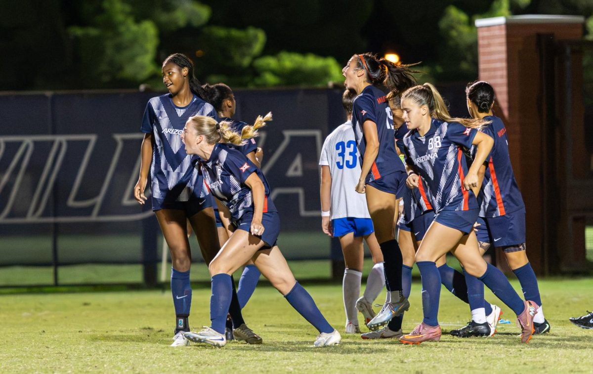 Lainey and her teammates celebrate the first goal of the night for their team.