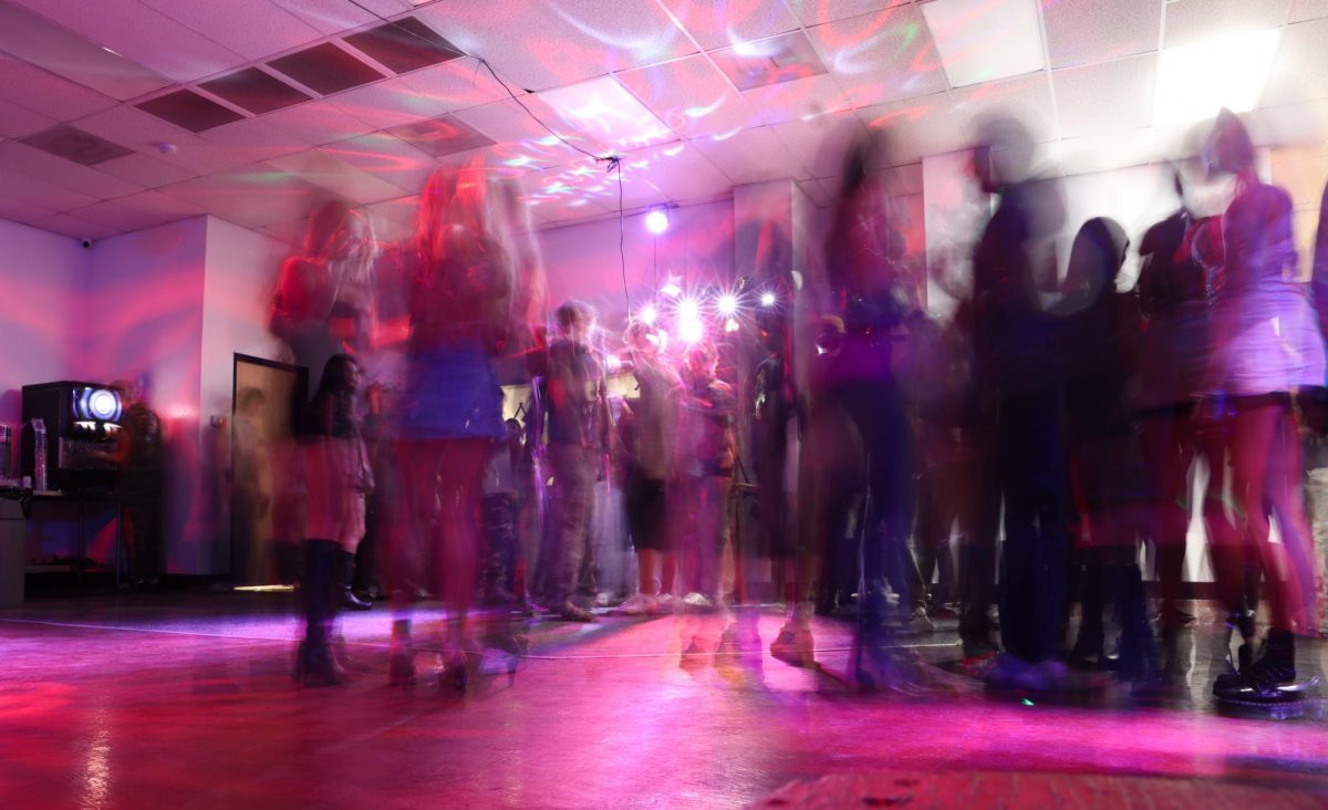 Attendes wait around inside before the concert on Sept. 24 at the new ZBT frat house.