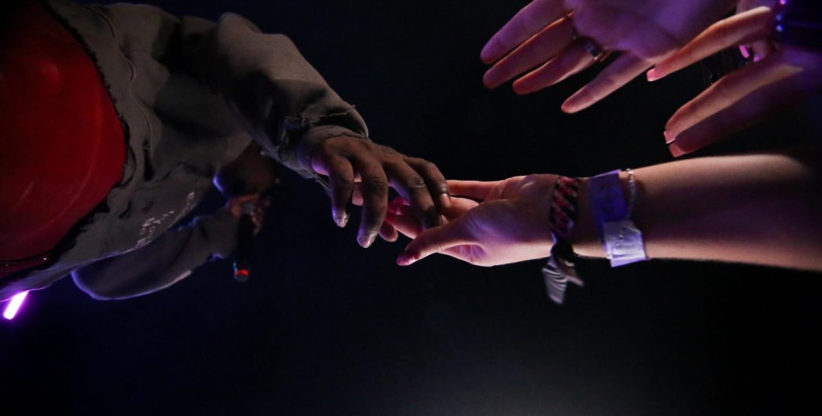Offset holds hands with a crowd member at the Rolling Loud One Big College Tour on Sept. 24.