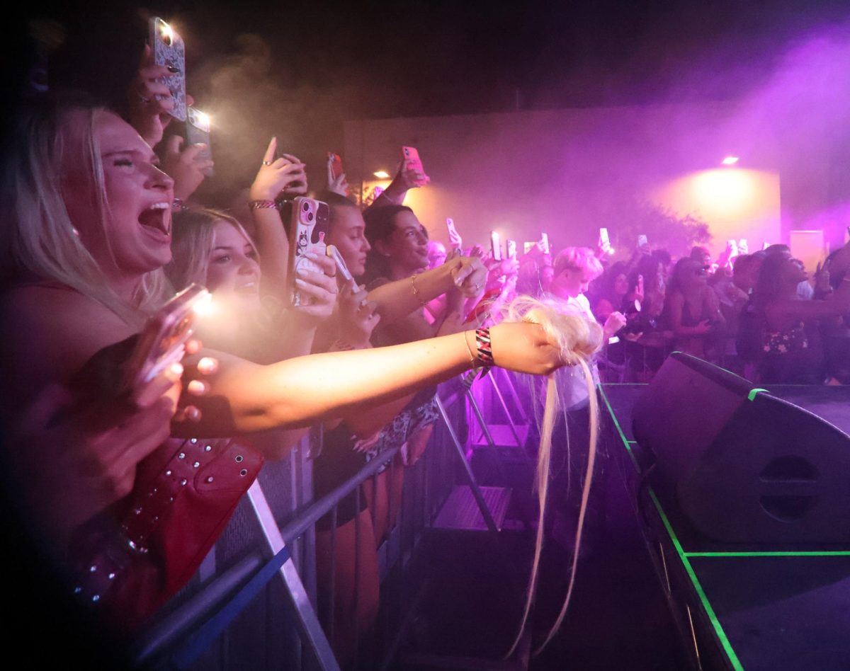A front row fan offers Offset a chunk of her hair at the Rolling Loud One Big College Tour on Sept. 24.