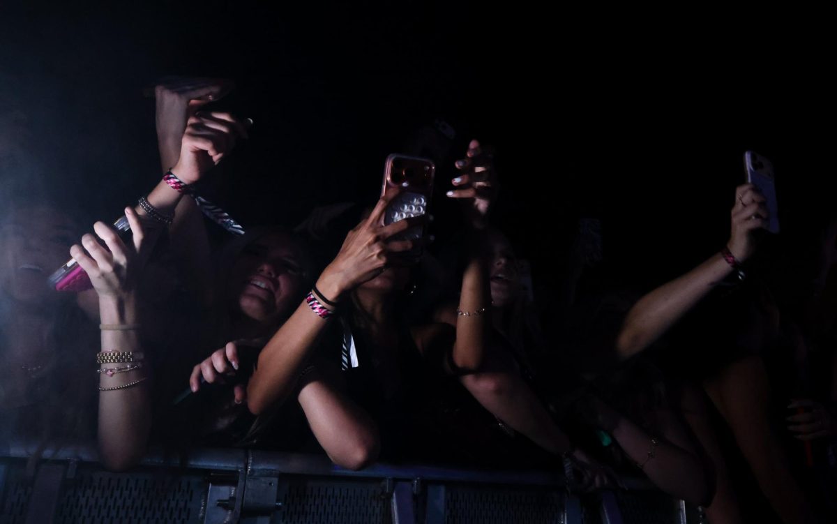 Attendees enjoy the concert in the front row at the Rolling Loud One Big College tour on Sept. 24.