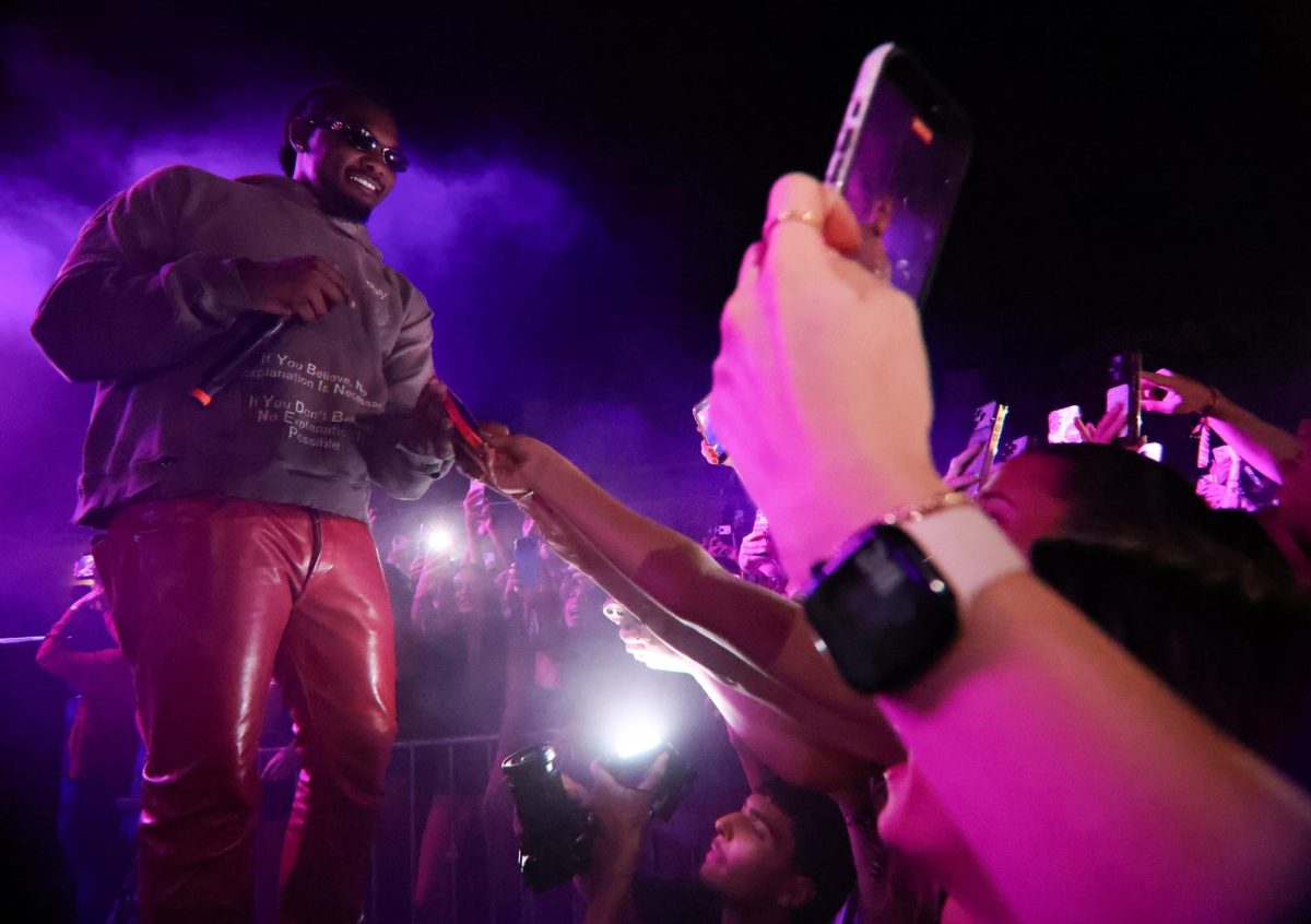 Offset takes a phone from the crowd to film a video at the Rolling Loud One Big College Tour on Sept. 24.