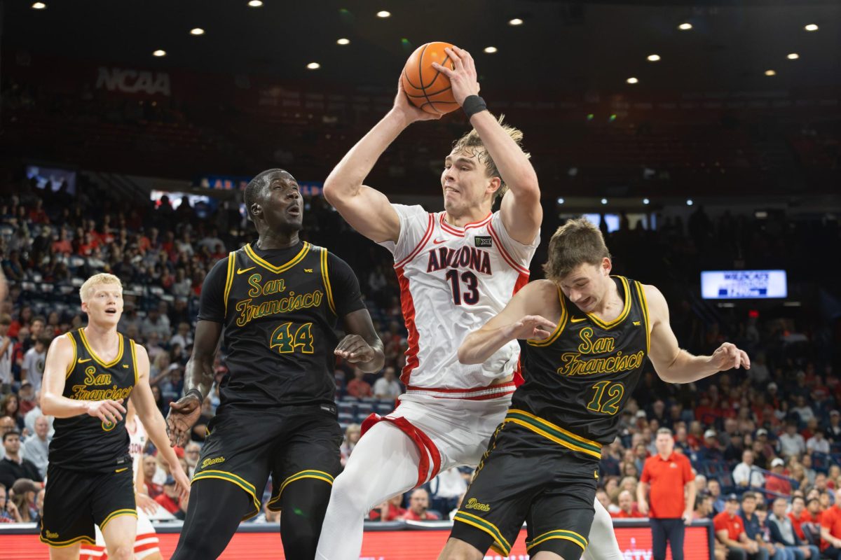 Motiejus Krivas drives the ball into the paint against San Francisco in McKale Center at ALKEME Arena on Oct. 13.
