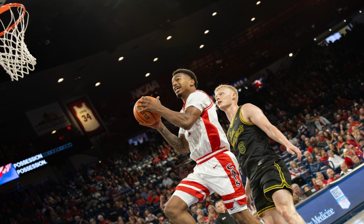 Cameron Holmes goes for the layup against San Francisco in McKale Center at ALKEME Arena on Oct. 13