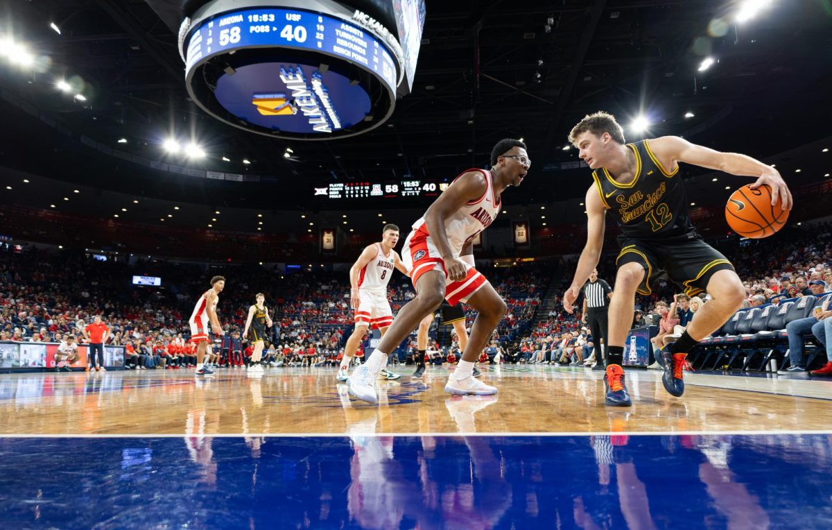 Bryce James defends in the second half against San Francisco in McKale Center at ALKEME Arena on Oct. 13 
