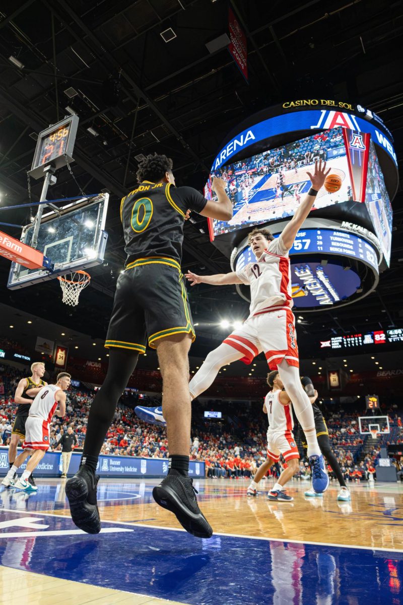 Ugnius Jarusevicius jumps to get possession of the ball on an inbound pass in the exhibition game against San Francisco in McKale Center at ALKEME Arena on Oct. 13.