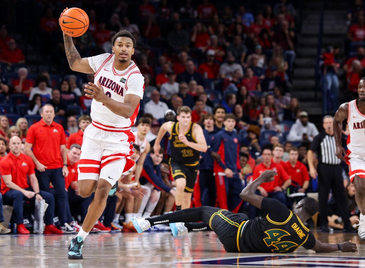 Cam Holmes grabs a lost ball against San Francisco in McKale Center at ALKEME Arena on Oct. 13.