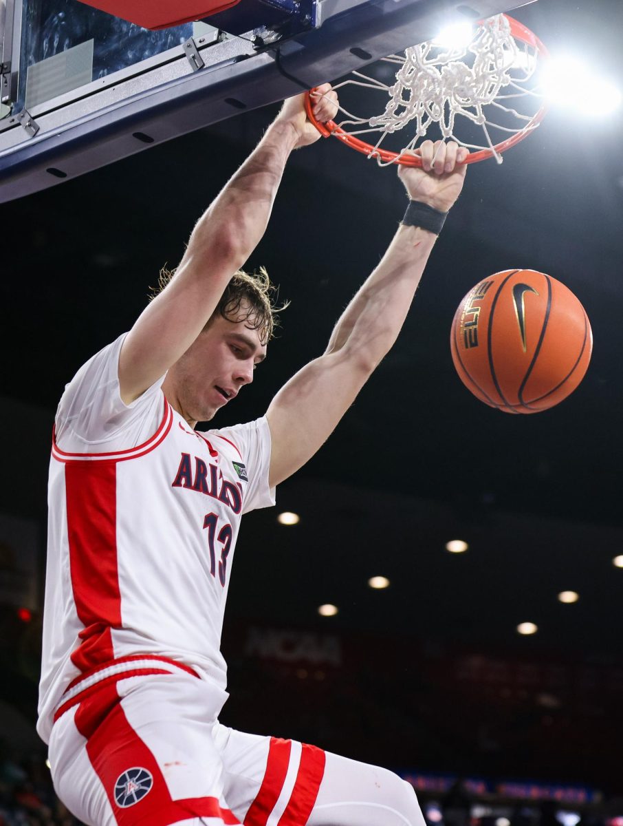 Motiejus Krivas dunks the ball against San Francisco in McKale Center at ALKEME Arena on Oct. 13. Krivas scored the most points on the night.