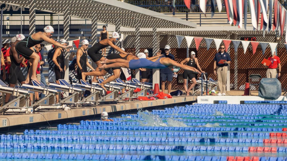Swimmers switch off during the womens 200 yard medley relay during the Red v. Blue intrasquad meet at the Hillenbrand Aquatic Center of Oct. 2.