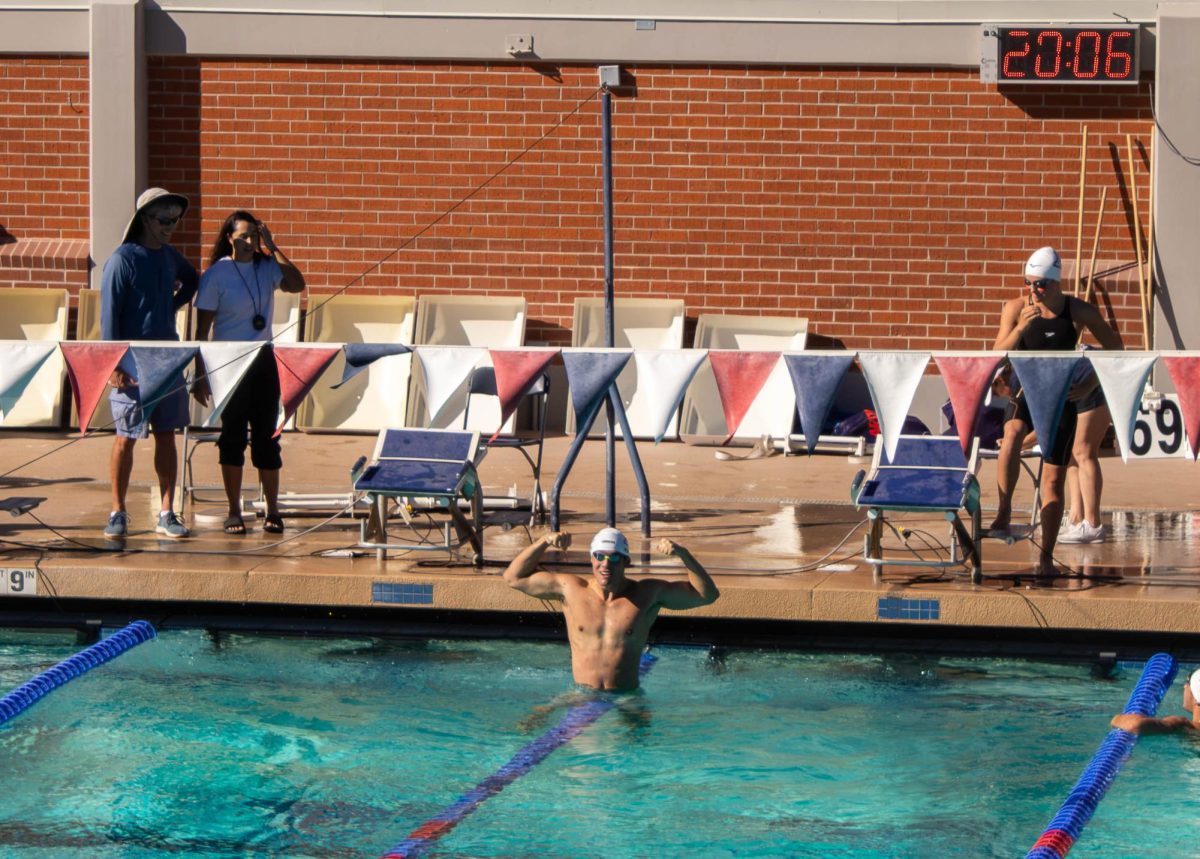 Ocean Morin celebrates his time of 53.43 for the men's 100 yard breastroke during the Red v. Blue intrasquad meet at the Hillenbrand Aquatic Center of Oct. 2.