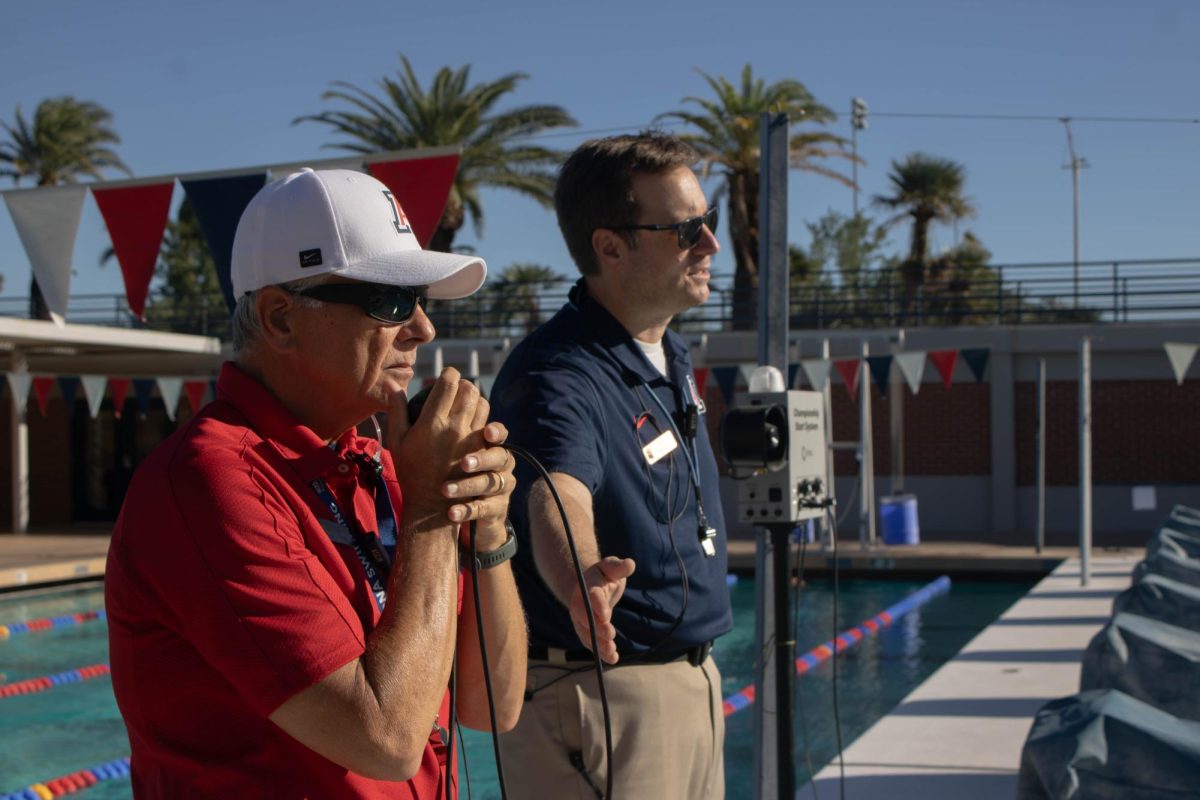 The deck referee directs the starter for a race during the Red v. Blue intrasquad meet at the Hillenbrand Aquatic Center on Oct. 2.