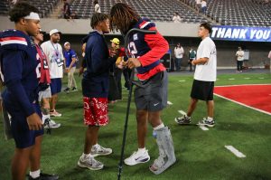 Tre Spivey wears a boot and crutch after getting injured at the end of the first half against Cincinnati on Oct. 3 at Casino Del Sol Stadium.