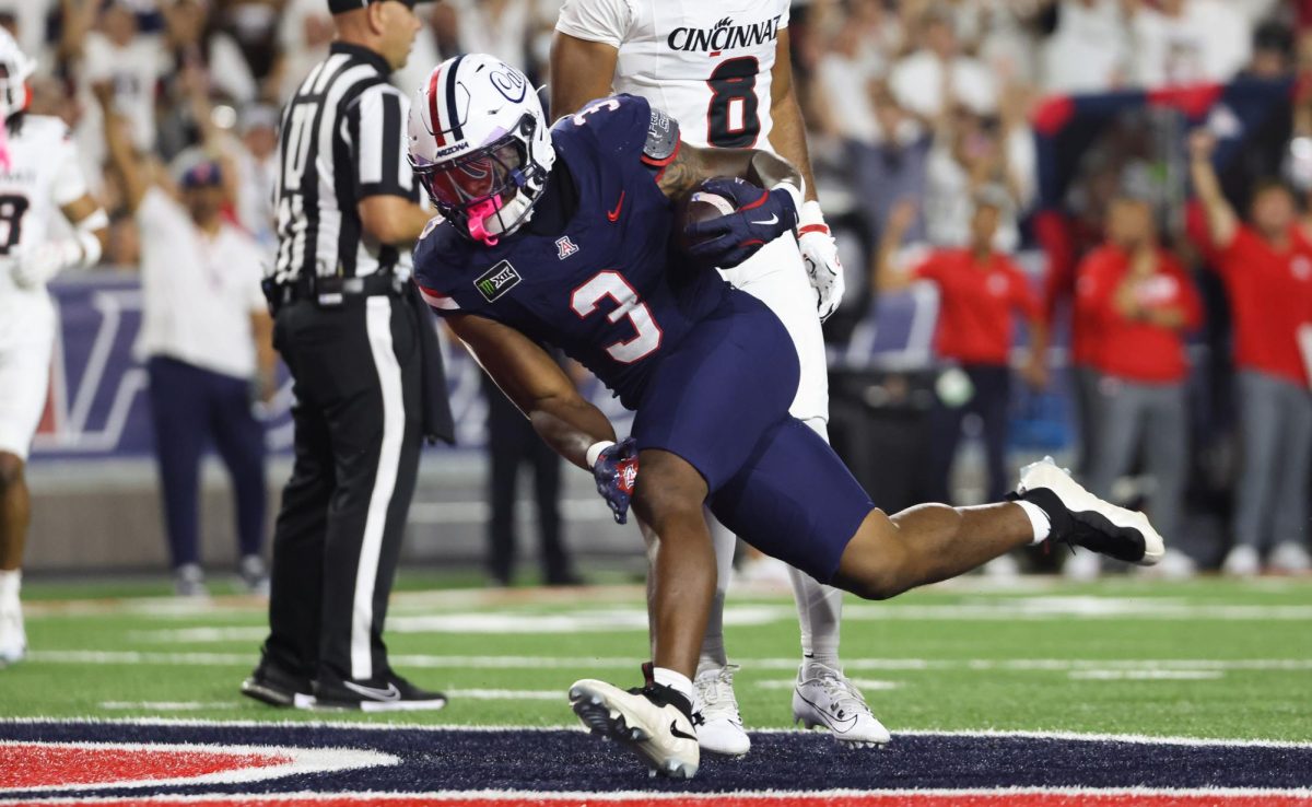 Kedrick Reescano dashes into the endzone for the first score of the game against Cincinnati on Oct. 3 at Casino Del Sol Stadium.