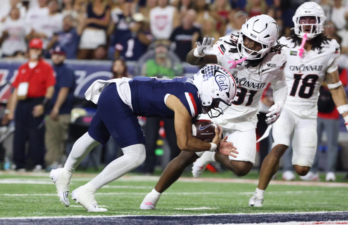 Noah Fifita dives into the end zone for a touchdown against Cincinnati on Oct. 3 at Casino Del Sol Stadium.